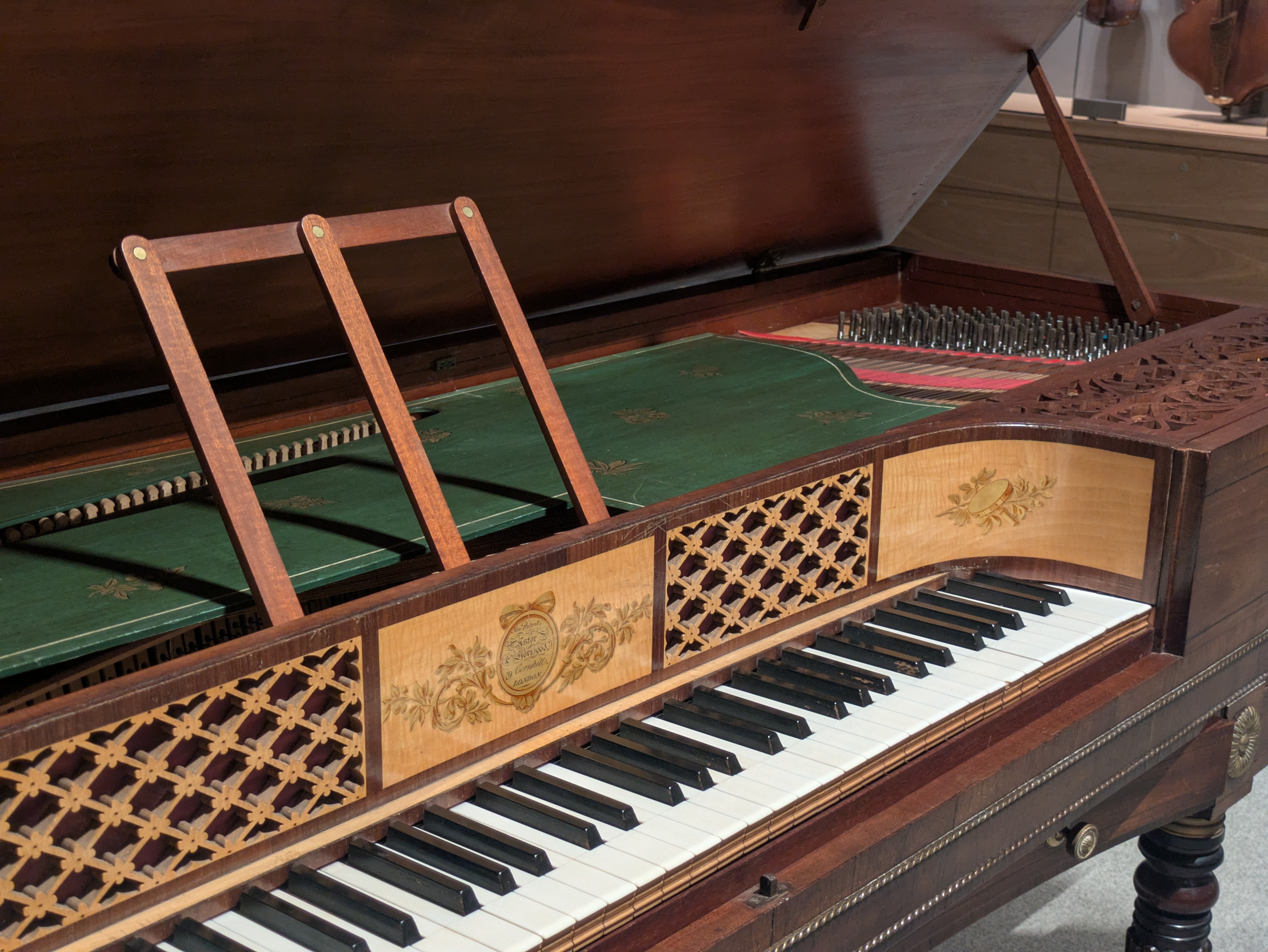 Early 19th-century square piano by Astor & Horwood, featuring satinwood veneer and silk-lined fretwork panels