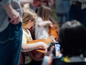 Girl playing the Lute at the Bate Collection of Musical Instruments