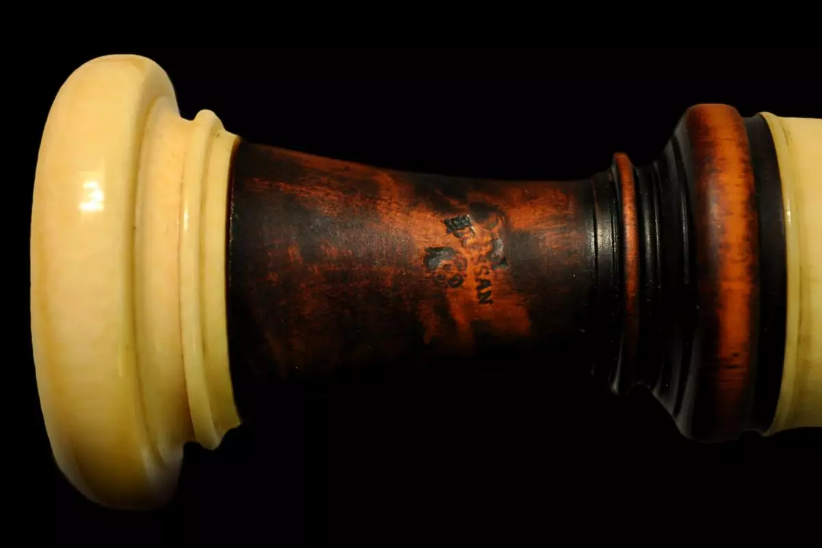 end piece with stamp 